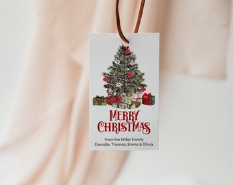 May include: A white gift tag featuring a red and green Christmas tree illustration with the text "Merry Christmas" in red. The tag also includes the text "From the Miller family Danielle, Thomas, Emma & Olivia".