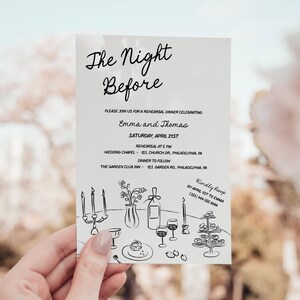 May include: A white invitation card with black text and a hand-drawn illustration of a table setting with candles, wine glasses, and a vase of flowers. The text reads "The Night Before" and includes the names "Emma and Thomas" and details for a rehearsal dinner celebrating their wedding.