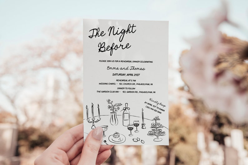 May include: A white invitation card with black text and a hand-drawn illustration of a table setting with candles, wine glasses, and a vase of flowers. The text reads "The Night Before" and includes the names "Emma and Thomas" and details for a rehearsal dinner celebrating their wedding.