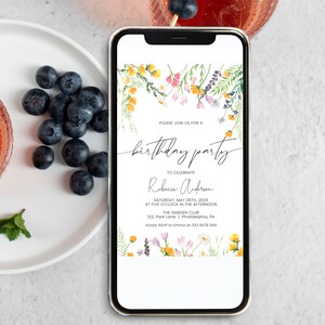 May include: A white and gold smartphone with a floral design on the screen. The screen displays a birthday party invitation for Rebeca Anderson, with the date, time, and location of the party. The text on the invitation reads: "Please join us for a birthday party to celebrate Rebeca Anderson Saturday, May 25th, 2025 at five o'clock in the afternoon The Garden Club 123, Park Lane | Philadelphia, PA Kindly RSVP to Emma at 333 5678 900"