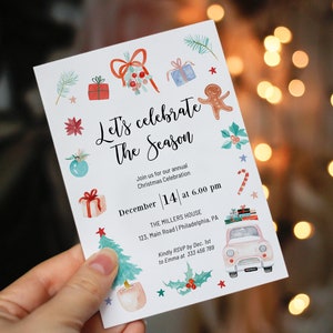 May include: A white Christmas invitation with watercolor illustrations of presents, ornaments, a gingerbread man, a candy cane, a car, and a Christmas tree. The invitation reads "Let's celebrate the season" and includes details for a Christmas celebration on December 14th at 6:00 pm at The Millers House.