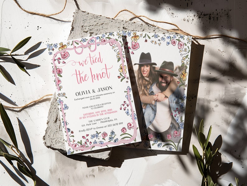 May include: A floral wedding invitation with a pink and white border. The invitation reads "We tied the knot" with the couple's names, Olivia and Jason, and the date and time of the wedding reception. A photo of the couple is included in the bottom right corner.