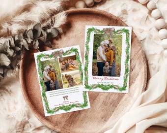 May include: Two Christmas cards with family photos, framed by green garland and a plaid bow. One card says "Merry Christmas" in red script. The other card has additional text and a bow graphic. Cards are on a wooden tray.