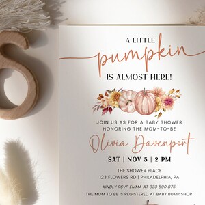 May include: A baby shower invitation with a watercolor illustration of pumpkins and fall foliage. The text reads "A Little Pumpkin is Almost Here!" and includes the name "Olivia Davenport" and the date and time of the shower.