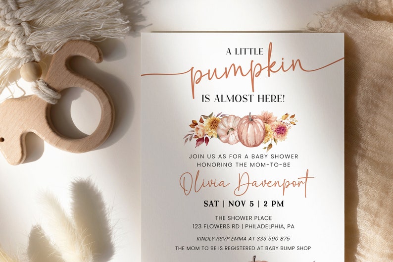 May include: A baby shower invitation with a watercolor illustration of pumpkins and fall foliage. The text reads "A Little Pumpkin is Almost Here!" and includes the name "Olivia Davenport" and the date and time of the shower.