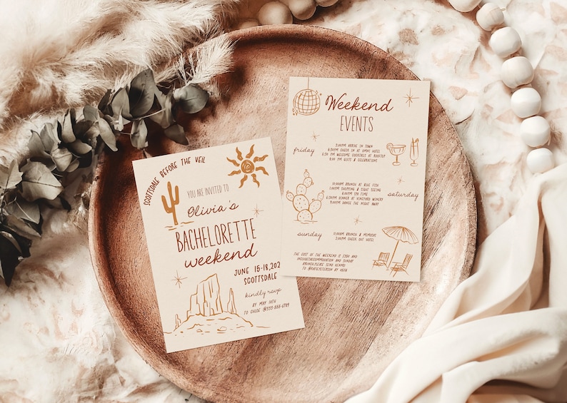 May include: Two invitations for a bachelorette weekend in Scottsdale, Arizona. The invitations are decorated with a desert theme, including cacti, a sun, and a mountain range. The text on the invitations reads "Scottsdale Before the Veil" and "You are invited to Olivia's Bachelorette Weekend June 15-18, 2021 Scottsdale."