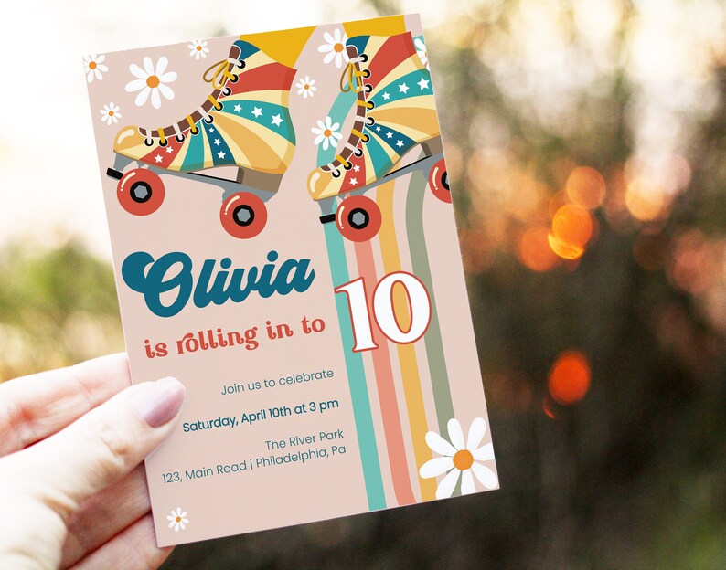 May include: A pink and white invitation with a rainbow stripe background. The invitation features a pair of roller skates with a red, white, and blue design. The text on the invitation reads "Olivia is rolling in to 10. Join us to celebrate Saturday, April 10th at 3 pm The River Park 123, Main Road | Philadelphia, Pa"