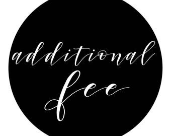 May include: A black circular graphic with the words "additional fee" written in elegant white script. The text is centered within the black circle, creating a simple yet striking design.