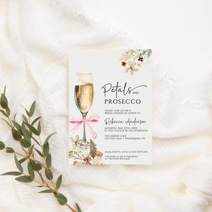 May include: A white card with a floral design and a glass of champagne. The text on the card reads "Petals and Prosecco" and includes details for a bridal shower for Rebecca Anderson.