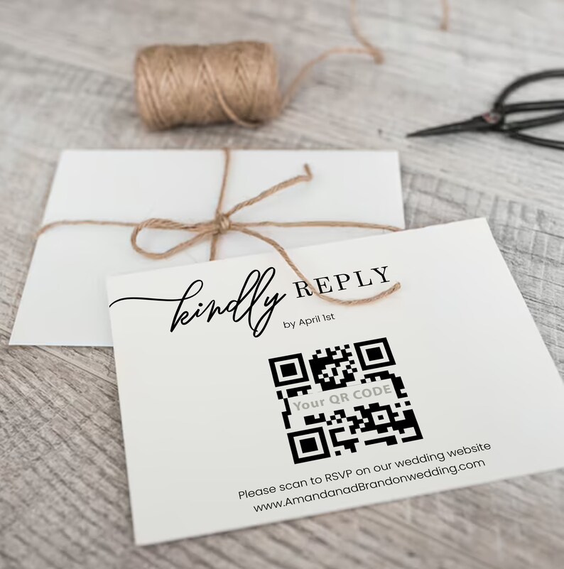 May include: A white card with the text "kindly REPLY by April 1st" and a black and white QR code. The text "Your QR CODE" is below the QR code. The text "Please scan to RSVP on our wedding website www.AmandanadBrandonwedding.com" is below the QR code.