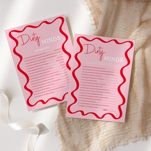 May include: Two pink cards with red borders and the text "Dirty Minds" in red and white. The cards are for a game with questions and answers.