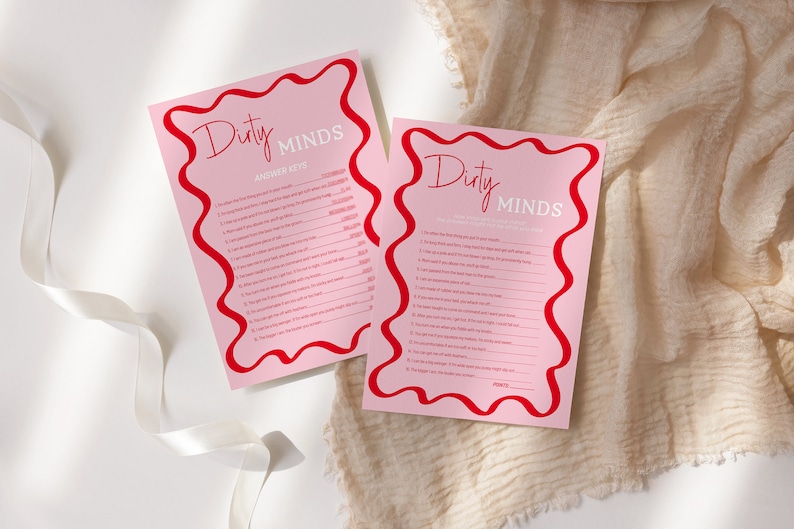 May include: Two pink cards with red borders and the text "Dirty Minds" in red and white. The cards are for a game with questions and answers.
