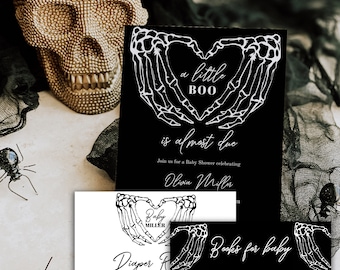 May include: Black and white baby shower invitation with a skeleton hand heart design. The invitation reads "a little BOO is almost due" and includes the name Olivia Miller. The invitation also includes a request for diapers or books for the baby.
