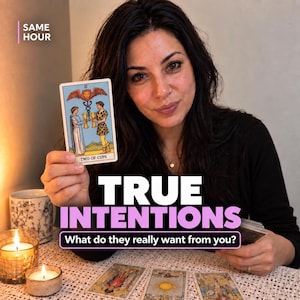 May include: A tarot card titled Two of Cups featuring two figures holding golden chalices under a winged lion symbol. The card is held up alongside text that reads SAME HOUR, TRUE INTENTIONS, and What do they really want from you?