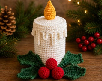 May include: A crocheted candle decoration featuring a white cylindrical body with textured wax drips, topped with a yellow flame. The base is adorned with dark green crocheted holly leaves and three bright red crocheted berries.