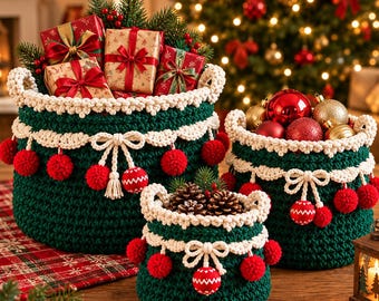 May include: Three dark green crocheted baskets with cream-colored trim, bows, and red pom-poms. The largest basket holds wrapped gifts, the medium basket contains red and gold ornaments, and the smallest basket holds pinecones.