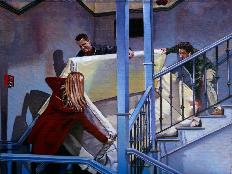 May include: Three people are carrying a large, white mattress up a flight of stairs. The person at the front is wearing a red jacket and is pushing the mattress up the stairs. The person in the middle is wearing a blue shirt and is holding the mattress on the left side. The person at the back is wearing a green shirt and is holding the mattress on the right side.