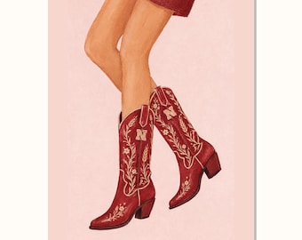 Puede incluir: Una ilustración de piernas con botas vaqueras de color rojo oscuro que presentan bordados florales blancos y una letra N prominente en la caña. Las botas tienen punta afilada y tacón, sobre un fondo de color rosa claro sólido.