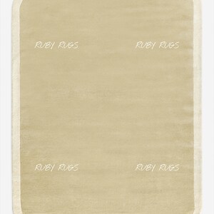 May include: A rectangular area rug in a solid light beige color with rounded corners and a slightly lighter cream-colored border. The text RUBY RUGS is printed in white in four locations across the surface of the rug, creating a repeating pattern.