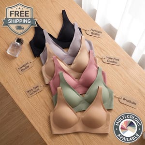 Può includere: Una collezione di sei reggiseni senza cuciture in nero, viola chiaro, beige, rosa antico, verde salvia e marrone chiaro. Ogni reggiseno presenta uno scollo a V, spalline larghe e coppe modellate. Alcuni hanno etichette con scritto Premium Quality, Wire-Free Comfort o Breathable.