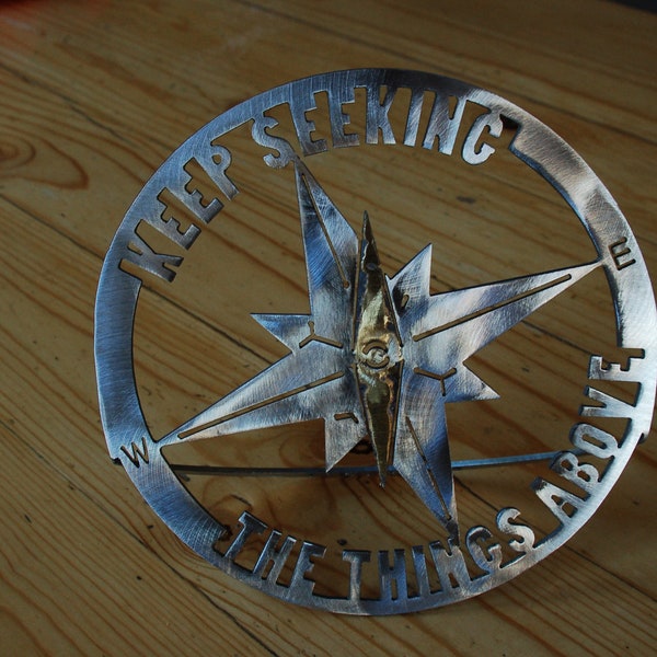 Metal sculpture of compass for tabletop