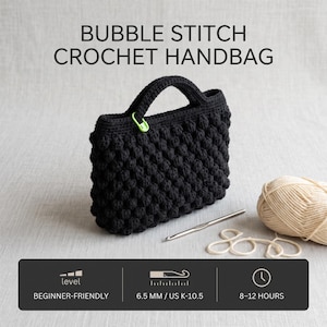 May include: A black crochet handbag featuring a bubble stitch pattern with a lime green stitch marker attached to the handle. Beside it lies a silver crochet hook and a ball of beige yarn. Text reads: BUBBLE STITCH CROCHET HANDBAG, BEGINNER-FRIENDLY, 6.5 MM / US K-10.5, 8-12 HOURS.