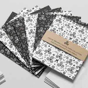 May include: A collection of black and white patterned papers featuring triskelion and primitive symbols, held together by a tan paper band labeled CELTIC DREAMS | DIGITAL PAPER COLLECTION Hand-Drawn Primitive & Triskelion Patterns.