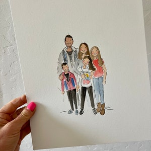 May include: Watercolor portrait of a family of five, featuring two adults and three children. The artwork is on white paper and held by a hand with pink nail polish. The family is dressed in casual attire.