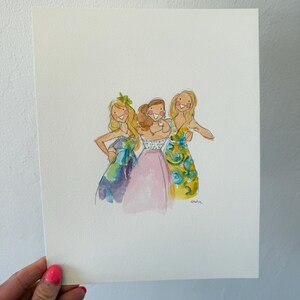 May include: Watercolor illustration of three women in colorful dresses. The women are depicted with blonde hair and are smiling. The dresses are in shades of blue, pink, and yellow with floral patterns. The artwork is on a white background.