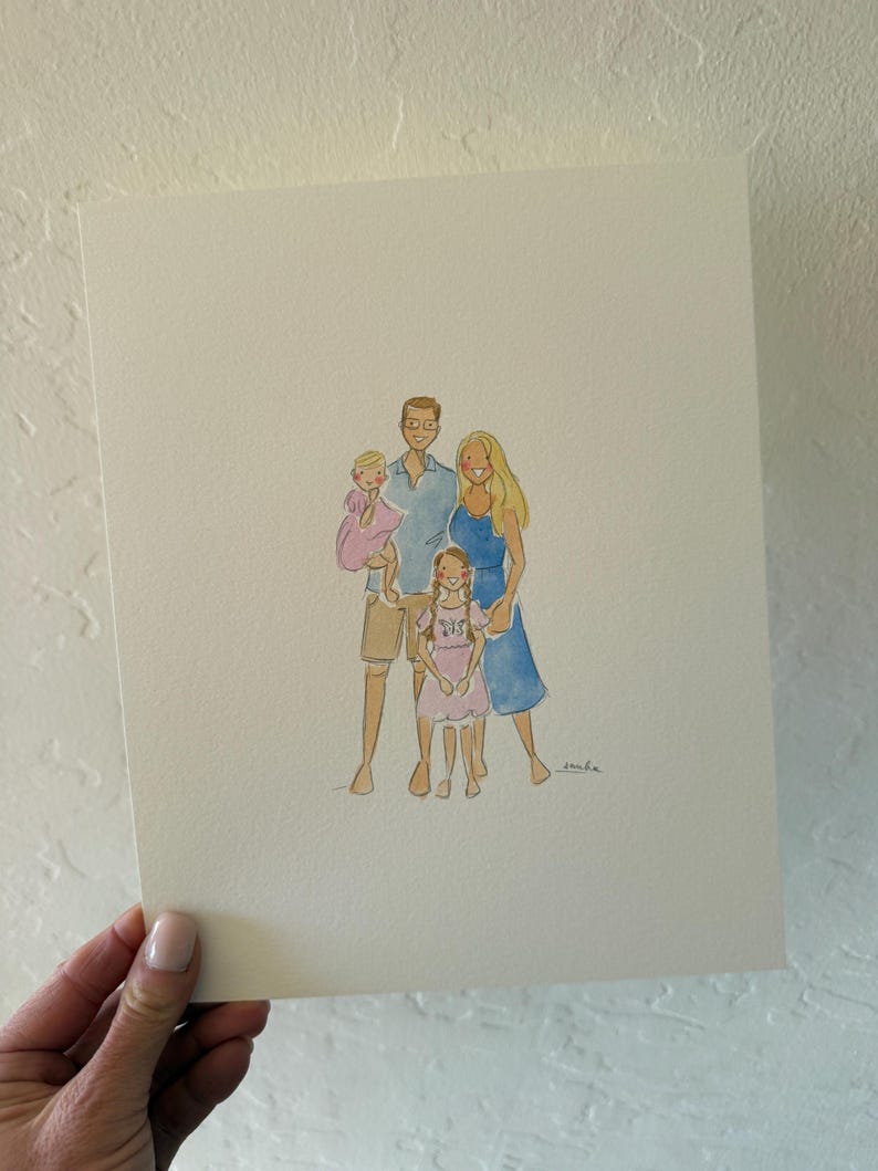 May include: Watercolor family portrait featuring a family of five. The artwork depicts a man in a blue shirt, a woman in a blue dress, and three children in pink dresses and shorts. The portrait is on a white paper.