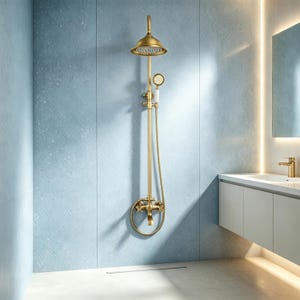 May include: A brushed gold shower system featuring a large round overhead shower head, a handheld shower attachment with a white handle, a vertical pipe, and two cross-handle valves mounted on a wall with a blue tiled surface finish.