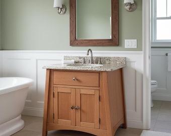 May include: A wooden bathroom vanity cabinet with a light brown finish, featuring one top drawer and two lower cabinet doors with metal hardware. The vanity is topped with a speckled granite countertop, a silver faucet, and a sink basin.