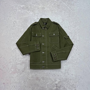 May include: An olive green utility jacket featuring a structured collar, a front button placket, and two chest pockets with buttoned flaps. The jacket includes long sleeves with buttoned cuffs, shoulder epaulets, and visible contrast stitching throughout.