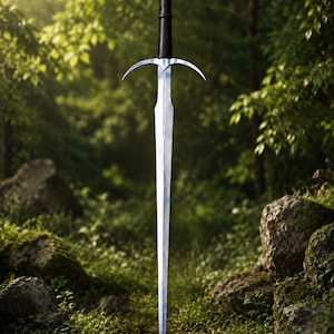 May include: A longsword with a double-edged steel blade, a slender black grip, and a curved metal crossguard. The pommel is spherical with a ribbed texture and features a small metal ring attached to the top, extending vertically in a forest.