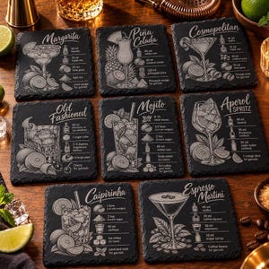 Nine black slate coasters are arranged in a grid, each engraved with a different cocktail illustration, recipe, and title.