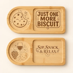 May include: Two rectangular bamboo serving trays with rounded ends. The top tray features a circular engraving of a smiling cookie and the text JUST ONE MORE BISCUIT. The bottom tray displays an engraving of wine, grapes, and cheese with the text SIP, SNACK & RELAX.