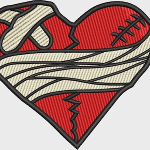 May include: An embroidered patch in the shape of a red heart with a jagged crack down the center. The heart is wrapped in off-white bandages with black outlines and features a stitched wound detail on the upper right side with black thread.