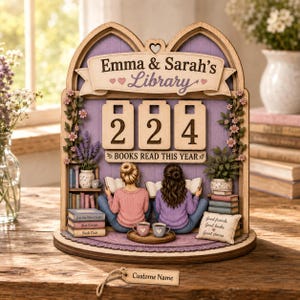 May include: A wooden arched display featuring the text Emma & Sarah's Library and Books Read This Year with the number 224. It depicts two figures reading books, shelves with miniature books, potted plants, and a pillow labeled Good friends Good books Great stories.