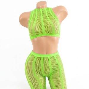 May include: A neon green two-piece set consisting of a sleeveless high-neck crop top and matching mid-thigh length shorts. The garment features a repeating pattern of vertical solid bands alternating with sections of open-knit fishnet mesh fabric.