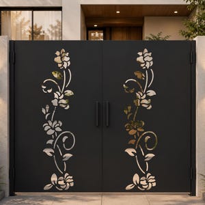 May include: A double gate made of matte black metal featuring a vertical laser-cut floral pattern on each panel. The design displays stylised roses with stems and leaves, creating a cutout effect that allows light to pass through the metal surface.