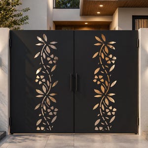 May include: A double gate made of matte black metal featuring a vertical laser-cut design of stylised flowers and leaves running down the centre of each panel. The gate has two simple vertical handles and is mounted between two white pillars.