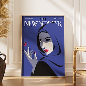 May include: A rectangular wall art print featuring a stylized illustration of a person wearing a blue head covering. The text reads THE NEW YORKER, Price $9.99, and Dec. 1, 2025. A small red butterfly is near the person's hand against a blue background.