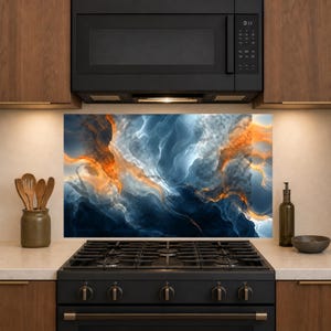 May include: A rectangular kitchen backsplash panel featuring an abstract fluid art design with swirling patterns of deep navy blue, bright white, and vibrant orange tones, positioned behind a black gas stove and below a black microwave oven.