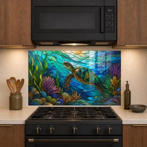 May include: A rectangular kitchen backsplash panel featuring a vibrant underwater scene with a sea turtle swimming among colorful coral reefs, seaweed, and small fish, rendered in a stained glass style with deep blues, greens, and purples.