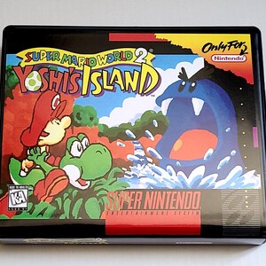 May include: A Super Nintendo Entertainment System video game box for Super Mario World 2: Yoshi's Island. The cover art features Mario riding a green Yoshi, facing a large blue creature emerging from water. It includes the KA rating and Nintendo logo.