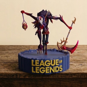 May include: A League of Legends character figurine featuring a dark, multi-limbed creature with a white mask, holding a lantern and a red-bladed scythe. The figure stands on a circular blue base with the text LEAGUE OF LEGENDS in gold lettering.
