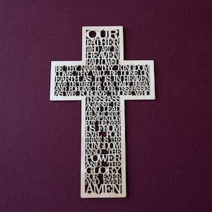 The Lord’s Prayer, precision laser cut in the shape of a cross or crucifix.