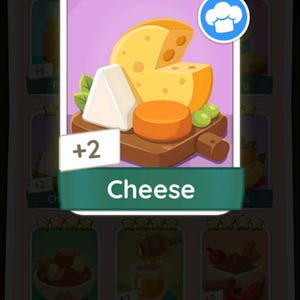 May include: A digital game sticker featuring a wooden board with a large yellow wedge of Swiss cheese, a smaller orange round cheese, and a white triangular cheese wedge. The sticker has three yellow stars at the top and the word Cheese below.