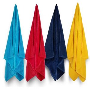 May include: Four colorful beach towels hanging against a white background. The towels are in shades of blue, red, navy, and yellow. The towels are folded in a triangular shape.
