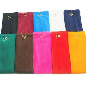 May include: A collection of ten colorful, rectangular pouches. Each pouch is a different solid color, including black, burgundy, blue, white, navy, green, brown, pink, red, and yellow. A gold-colored metal hook is attached to the top of each pouch.